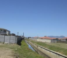 Cape Town’s rivers canalized historically to address flooding issues in the developing City are now significantly ecologically degraded, victims of dumping, and socially shunned as sites of criminal activity. Photo: Pippin Anderson