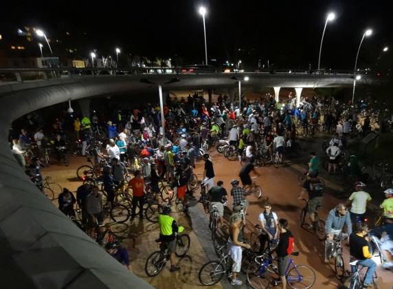 Thousands of cyclists gather under a full moon at Green Point in Cape Town, before cycling in mass through the city. Photo: Russell Galt