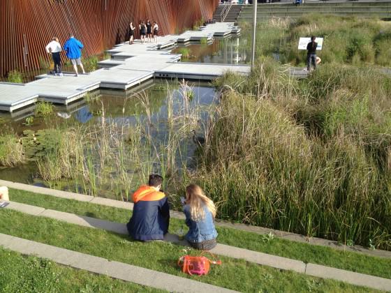 Visitors with Great Blue Heron, Tanner Springs Park. Photo: Mike Houck