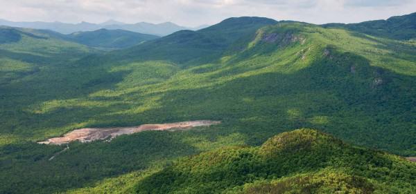 Existing wollastonite mine (foreground) will now expand 1 km2 into the Jay Mountain Wilderness (background), which until the successful November amendment was protected by the New York State Constitution. Photo: Carl Heilman II