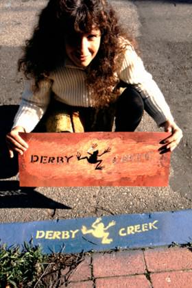 Urban Ecology member Nancy Lieblich stenciling storm drains in Berkeley in 1989. Photo courtesy of Richard Register