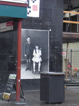 Illegal guerilla poster posting by Peter Drew, Adelaide CBD. Image is of a series old photograph of Adelaidians from the past that Peter unearther for the project. Photo: Paul Downton