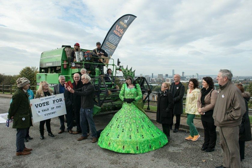 Two green goddesses meet in Everton Park serenaded by Ian Prowse to launch the Tale of Two Cities Campaign in October 2014