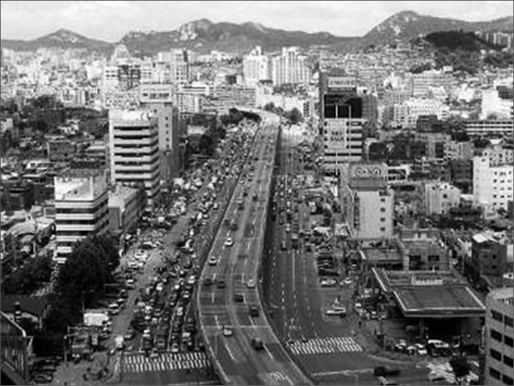 Cheonggyecheon stream in Seoul, with a highway running over it.