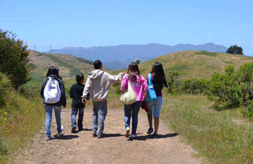 Image 15 - photo of five children hiking along a road