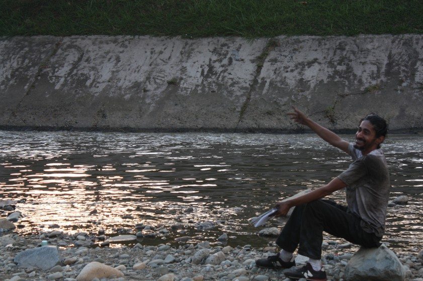 Homeless person, Medellin River. Photo: Claudio Valcamonico