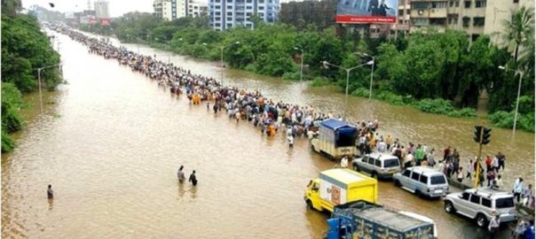 A flooded street with cars and people