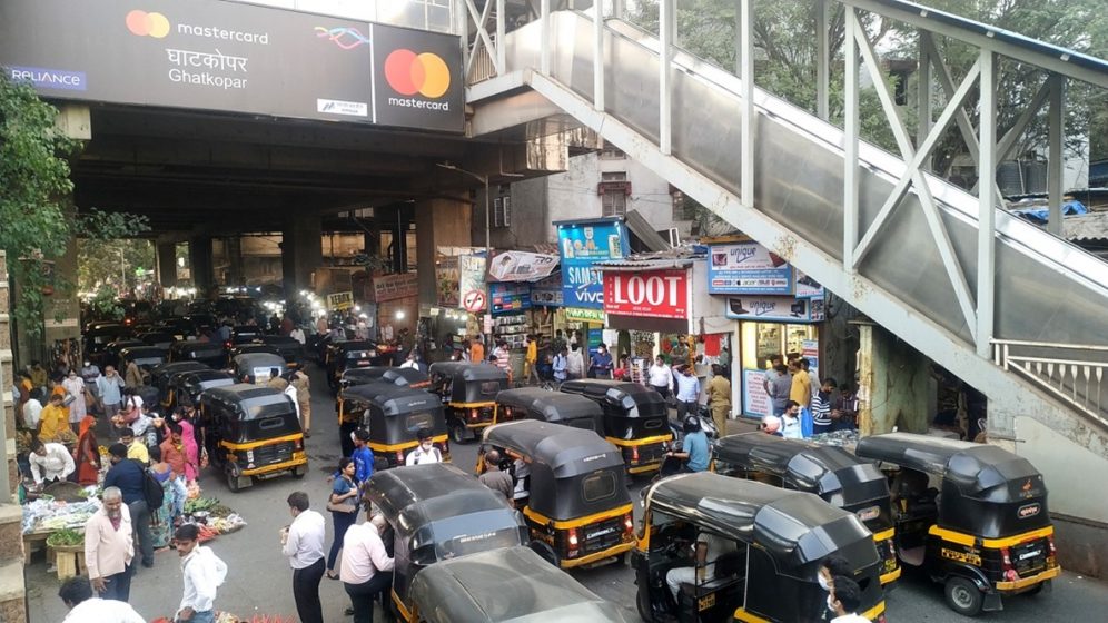 A busy street with cars and people