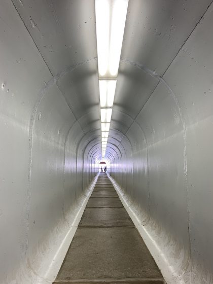 A picture of the inside of a concrete tunnel