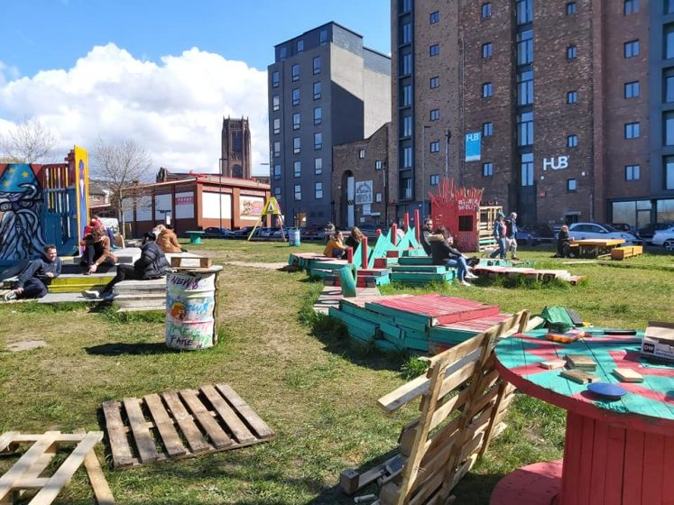 A picture of a field with wooden structures placed in it