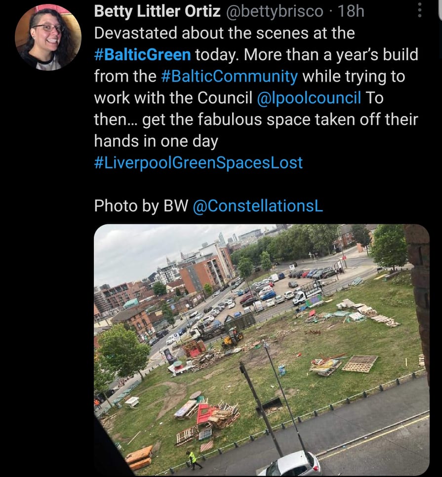 A screenshot of a social media post with an aerial picture of a fenced in field with trash scattered about