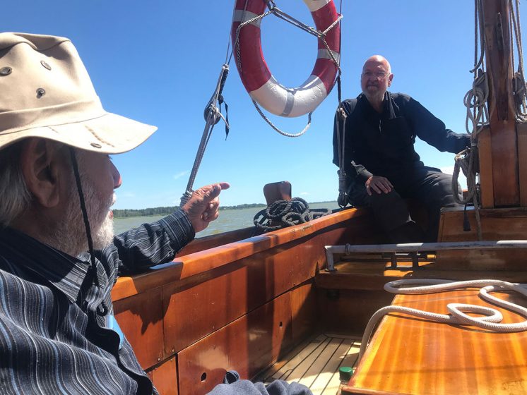 A picture of two people on a boat