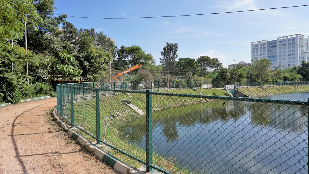 A picture of a fenced walkways along a lakeside