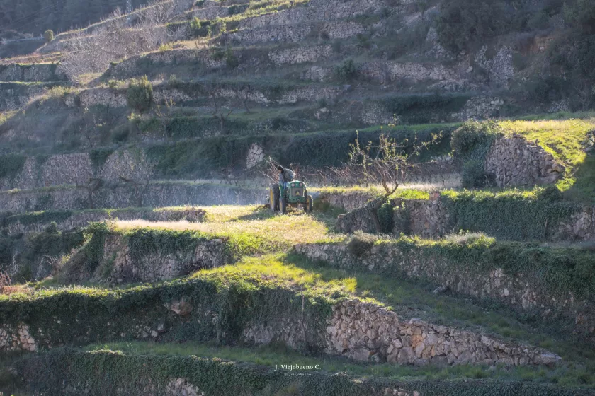 A tractor on a rocky hillside