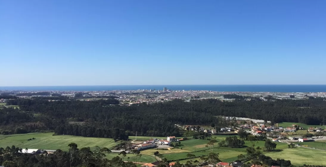 A picture of a city from on top of a hill overlooking a valley