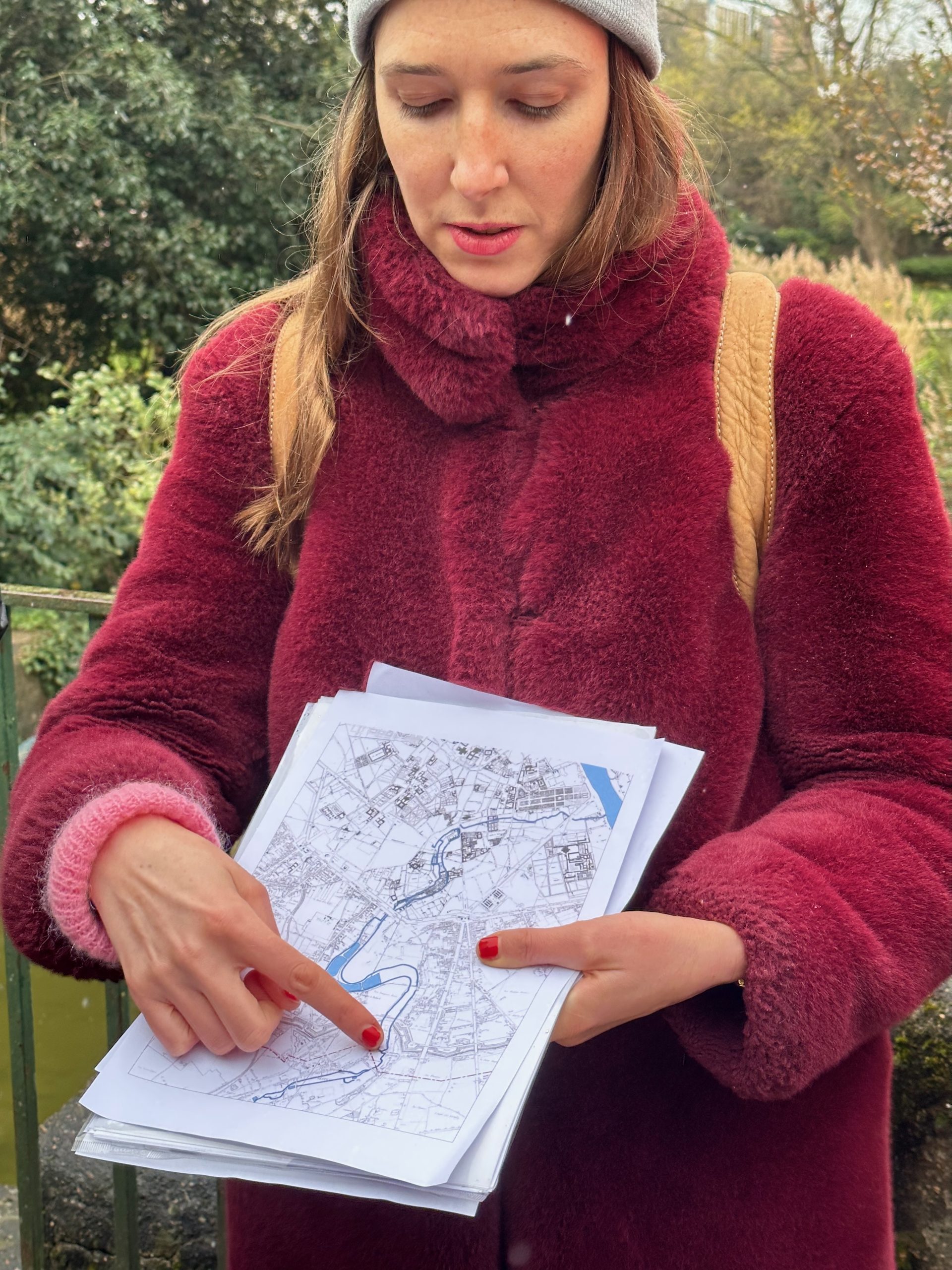 A person point to a map of a cityscape