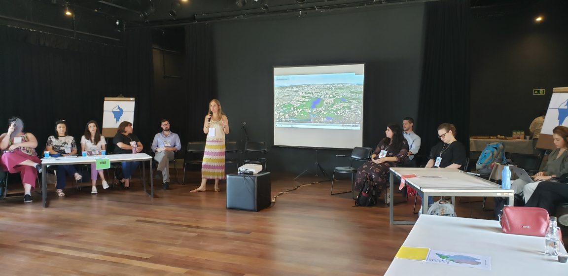 A person presenting a slideshow in front of a group of people