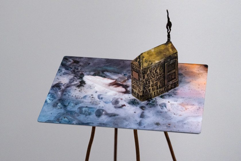 A miniature model of a house in the sea