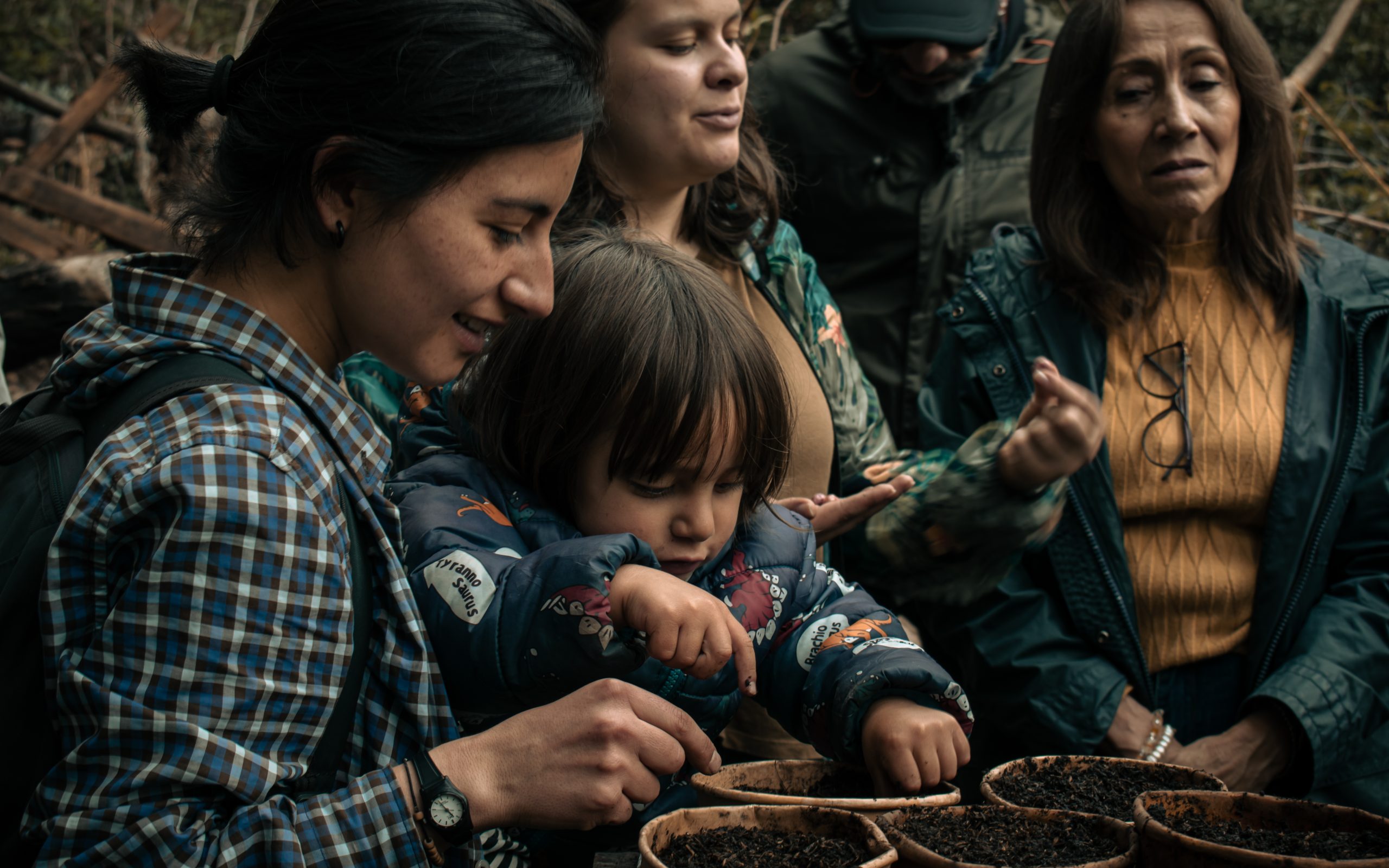 A group of women and children working together to create