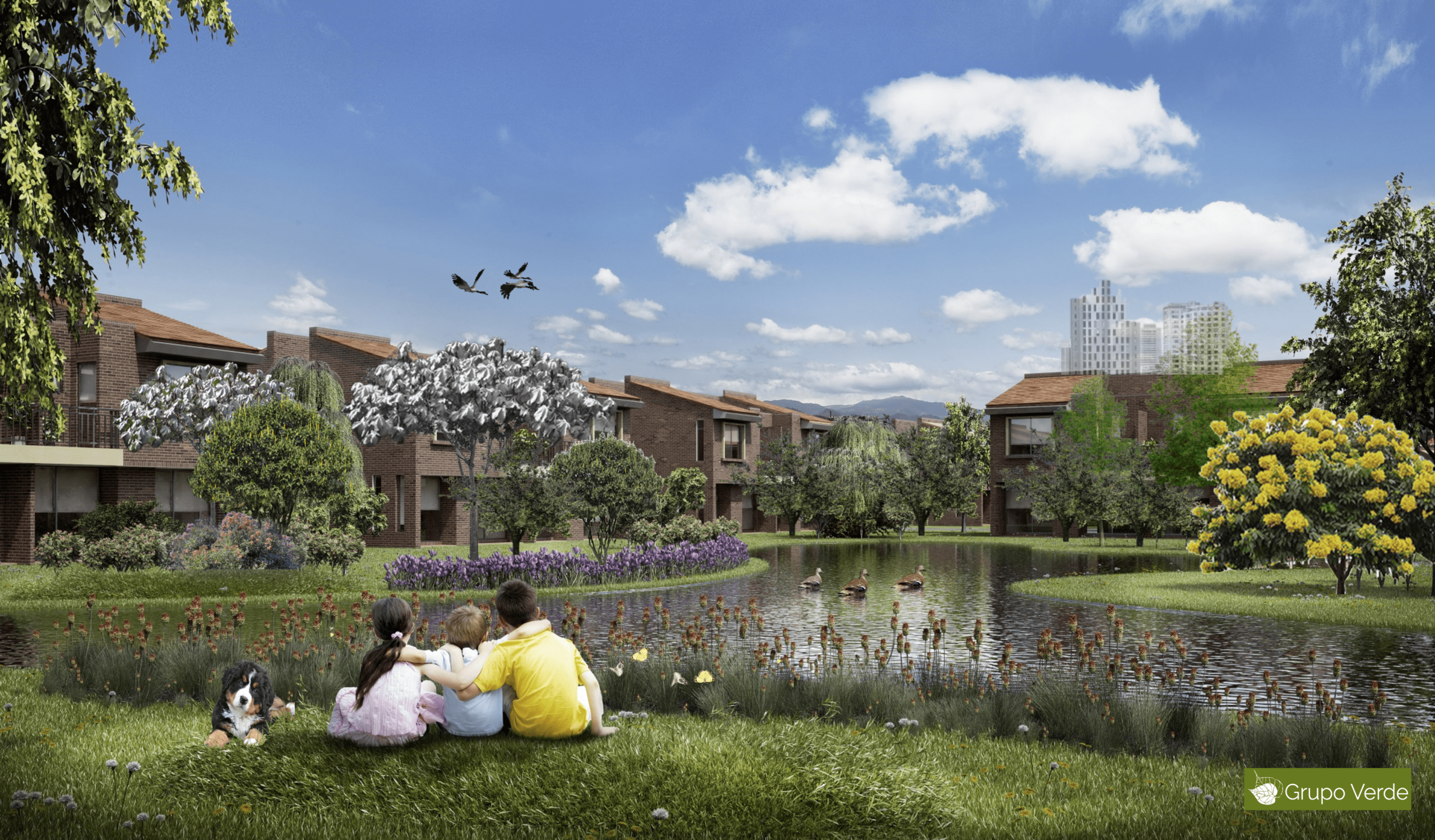 Three people sitting in the grass in a park