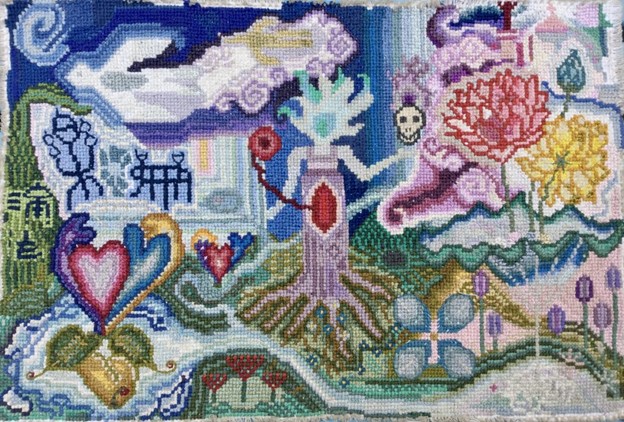 A colorful tapestry of natural flowers, a skull, and hearts