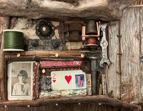 A wood frame with pictures and tools