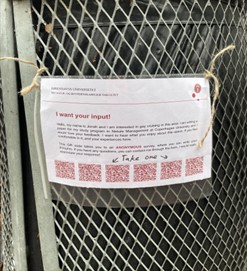 Photo of a printed flyer attached to a metal mesh fence, requesting public input for a Nature Management study at Copenhagen University. Flyer includes a brief introduction, invitation to an anonymous survey, and six QR codes at the bottom for easy access.